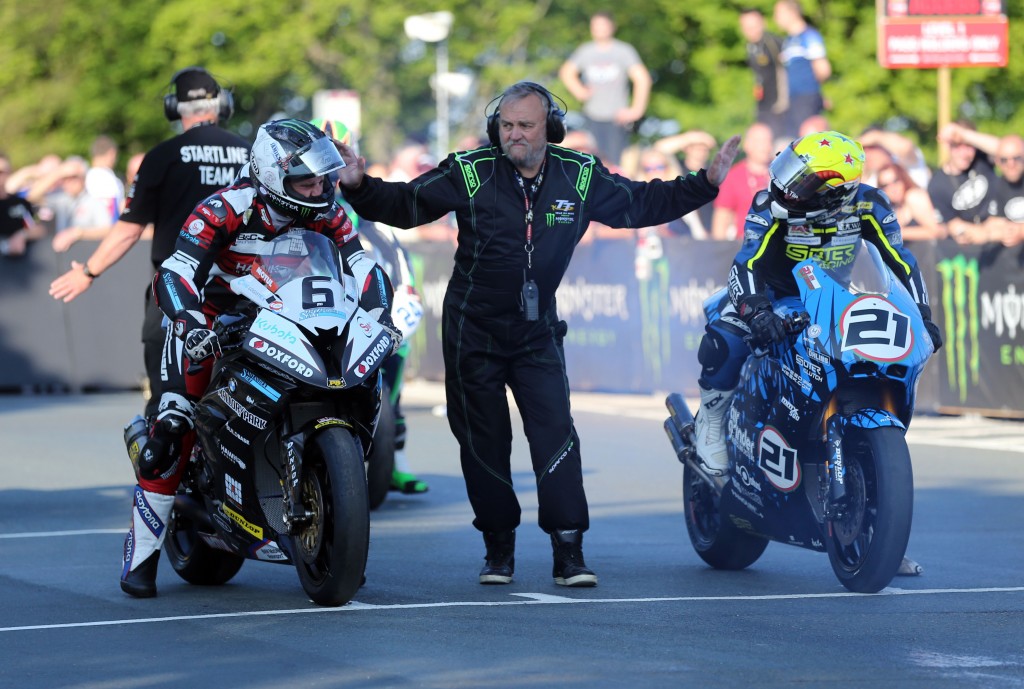 Michael Dunlop (BMW) (left) and Ian Lougher on the Suter MMX 580 two-stroke ready to start the second qualifying session at TT 2016 - the first run for the Superbikes