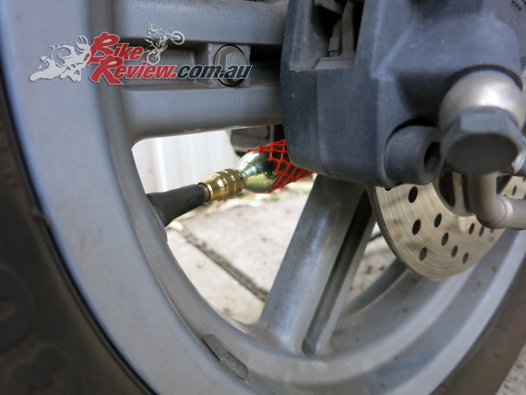 8. Gryyp Tyre Puncture Repair - Attach cylinder to adapter and screw in copy