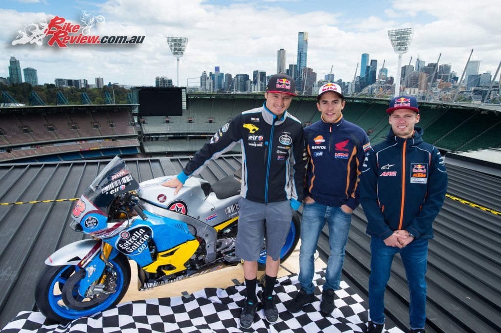 Miller, Marquez and Moto3's Brand Binder on the roof of the MCG with Miller's MotoGP machine.