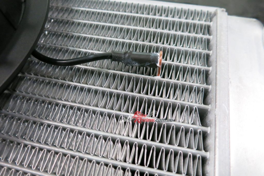 Pushing the sensor into the radiator requires finesse and judgment as any damage could be costly. 
