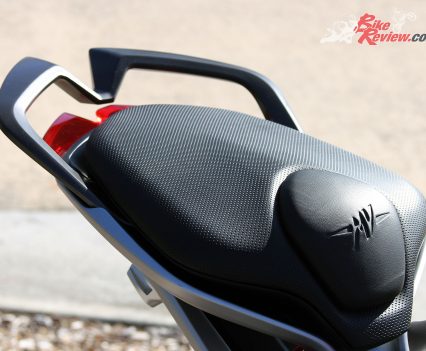 The stepped pillion seat gives them more leg room and a grab rail offers a point to hold onto, but does raise the pillion up behind the rider.