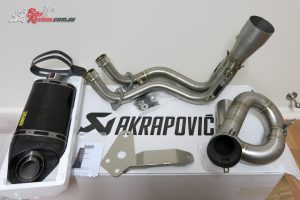 Everything in it's glory. Good idea to be careful unwrapping everything. Avoid using a blade on the muffler packaging as noted.