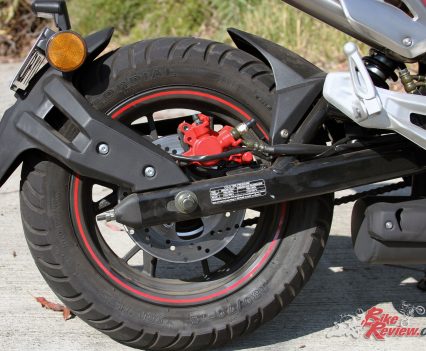 I'd convert the rear brakes to a traditional system. The swingarm mounted fender is also a cool touch, keeping the tail clean.