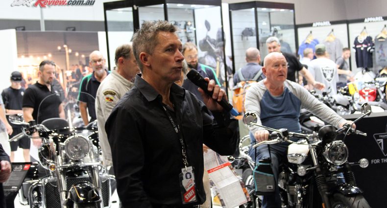 Troy Bayliss introduces the show in front of the Triumph stand