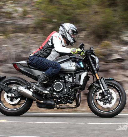 "Sliding one’s derriere across the seat a little and placing more weight on the inside ‘peg in the bends produces a good feeling in the way the bike tracks."