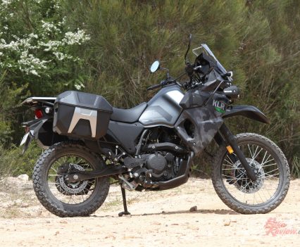 The sizeable fuel tank is balanced out by a tall seat, making the KLR's ride triangle comfortable...