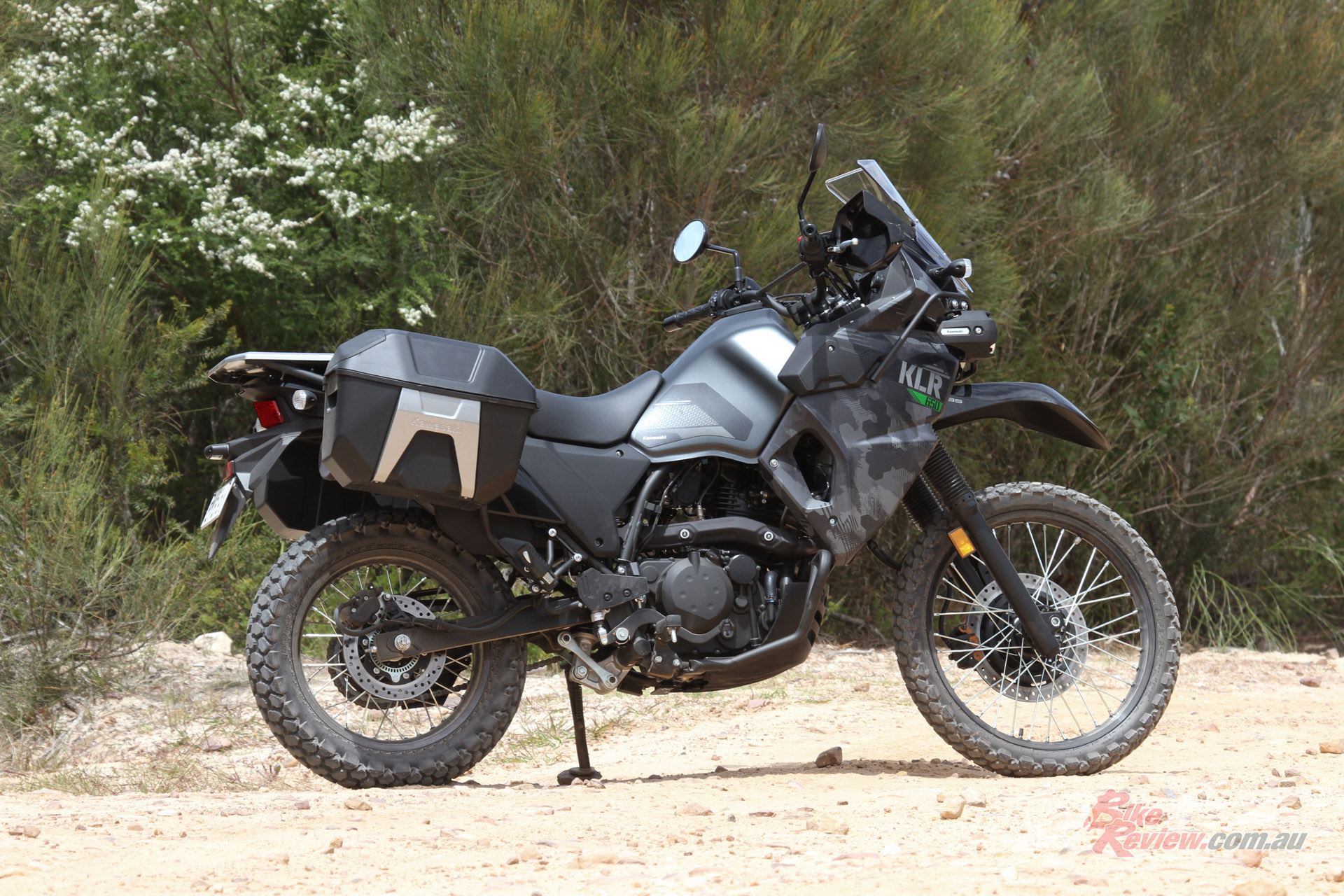 The sizeable fuel tank is balanced out by a tall seat, making the KLR's ride triangle comfortable... 