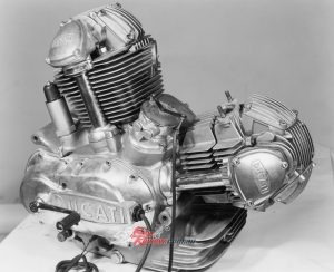 Two-valve cylinder head design with bevel-driven single overhead camshaft.