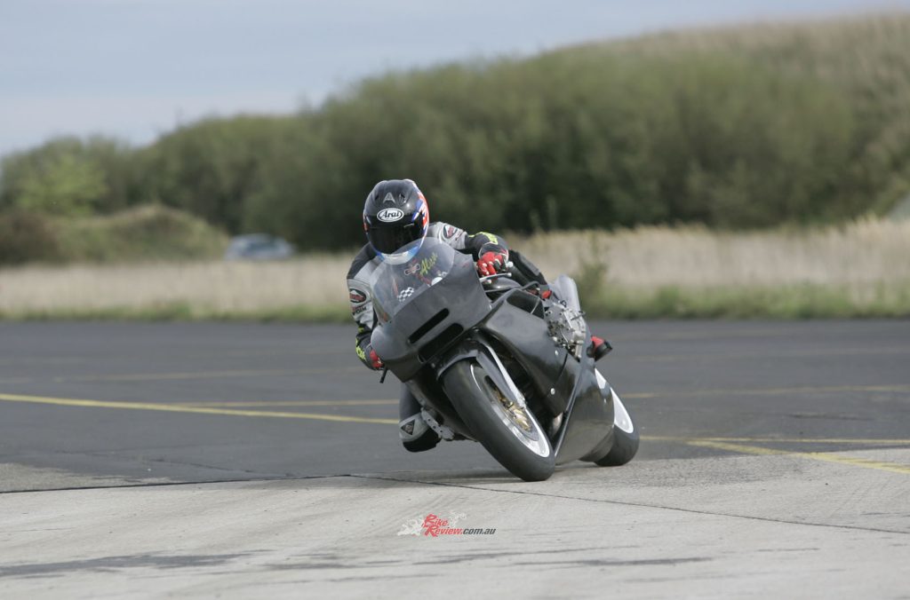 A boxer in a modern day MotoGP frame would be next to impossible. Look at how far those heads poke out and look at the lean angle from the top riders...