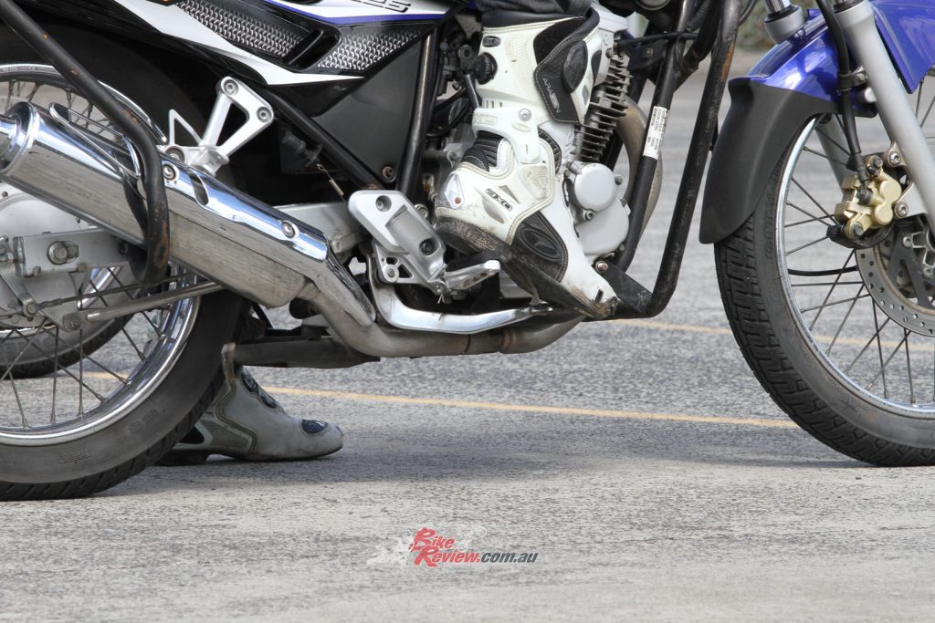 Motorcycle boots are also a good idea as they are designed not to effect your ability to use foot controls.