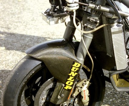 Carbon-fibre mud-guard. Big money back in the day...