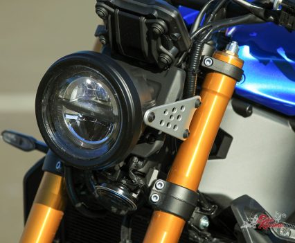 Up front is an LED light that has a cool steampunk look, held on by what looks like something out of a Meccano set.