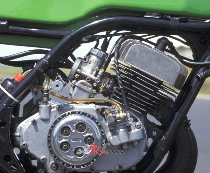 Air-cooled transverse in-line three-cylinder piston-port two-stroke with separate oil injection to 120-degree crankshaft.