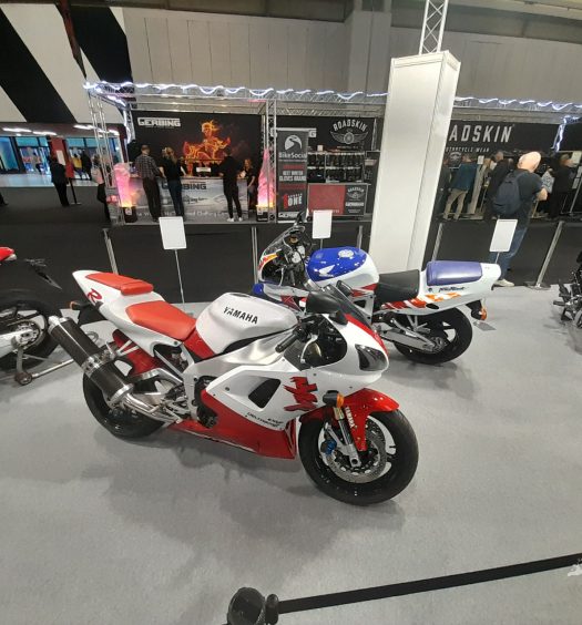 As you enter the arena, you're met with someone’s idea of a dream bike garage consisting of: A Vincent Black Shadow, Ducati 851,an early Fireblade an early YZF-R1, Yamaha Fs1-E, VFR750R, GSX-R750 Slingshot, and a ’73 Z900, all in immaculate condition.