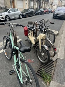 Plenty of these cool little Peugeot mopeds in France.