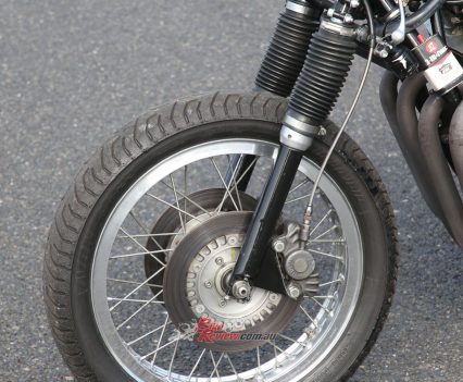 203mm Triumph cast iron discs with two-piston Lockheed calipers.