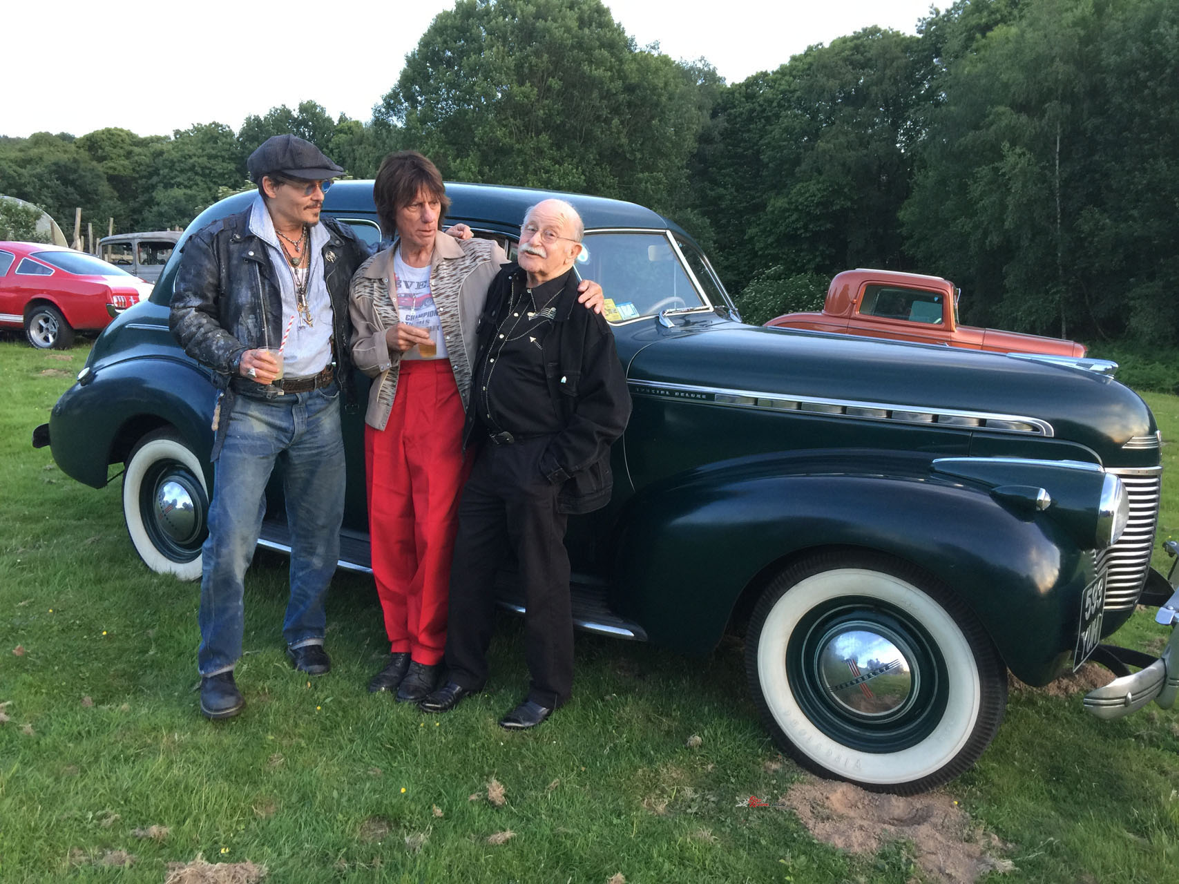 Robert Lusk with his neighbour Jeff Beck and visitor Johnny Depp with a 1939 Chevvy Hot Rod at a Beck Hotrod Party.