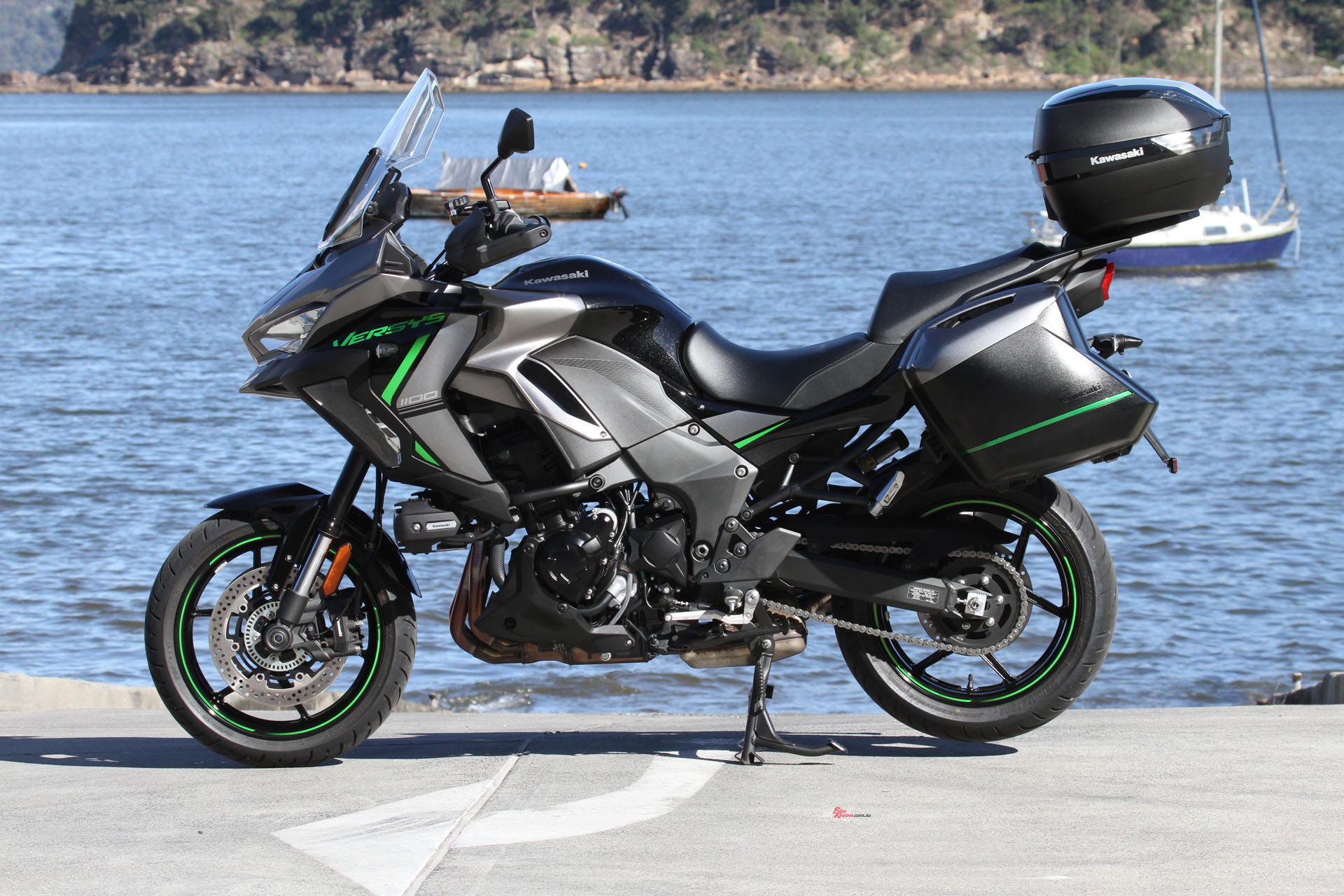The Versys 1100 S has the large screen (adjustable), hand guards and heated grips.