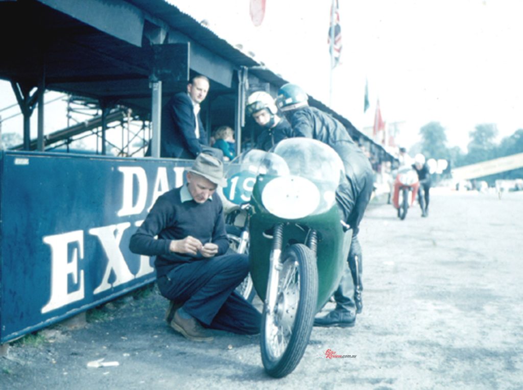 Francis Beart attending to AJS 7R with rider Terry Shepherd at Oulton Park.