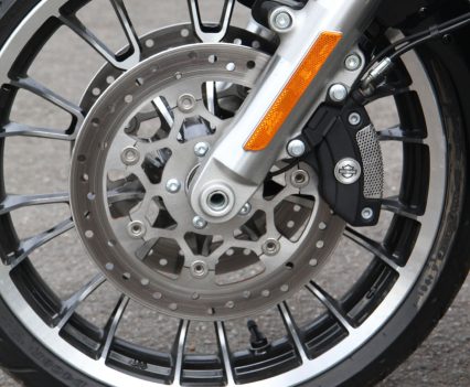 Dual floating front discs are paired with four-piston fixed calipers and linked ABS.