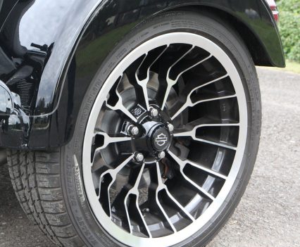 The twin rear wheels wear substantial 215/45R18 Dunlop tyres.