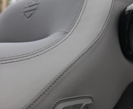 Rider and pillion heated-seat controls are conveniently mounted on the side of the seat.