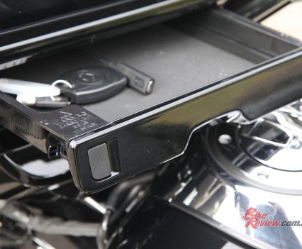 A pop-out dash tray provides handy storage and access to the USB-C connection.