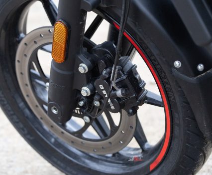A twin-piston caliper grips the 310mm semi-floating front disc.