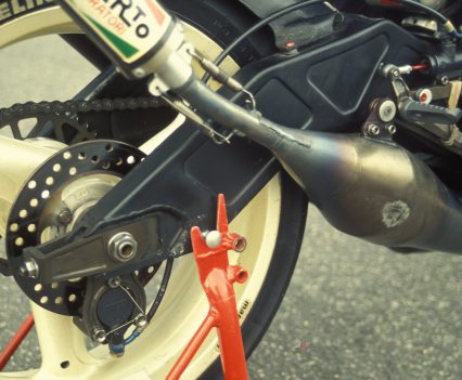 The expansion chamber dominates the GFR250’s compact rear packaging.