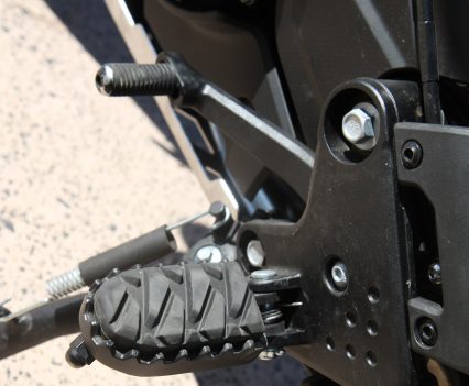 Serrated footpegs provide extra grip when riding on loose surfaces.
