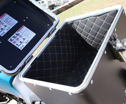 The padded interior extends to the lids of the factory-fitted luggage.