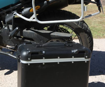 Removable aluminium panniers mount to sturdy frames on either side.