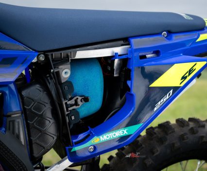 The 300SE’s foam air filter is tucked behind the side panel.