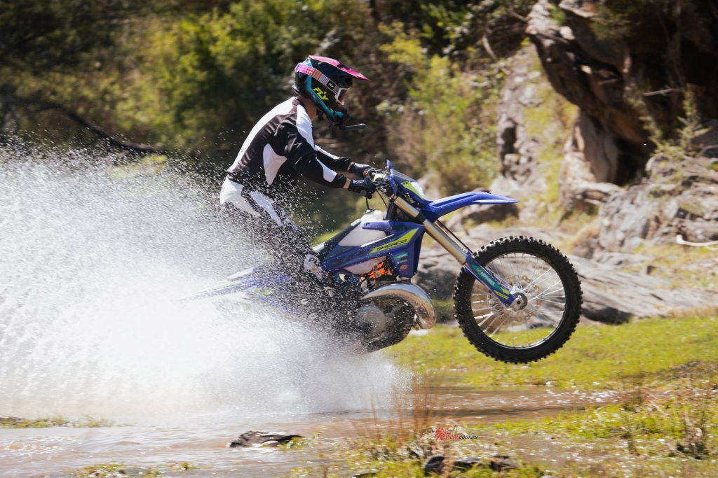The 300SE puts its two-stroke grunt to good use through the creek.